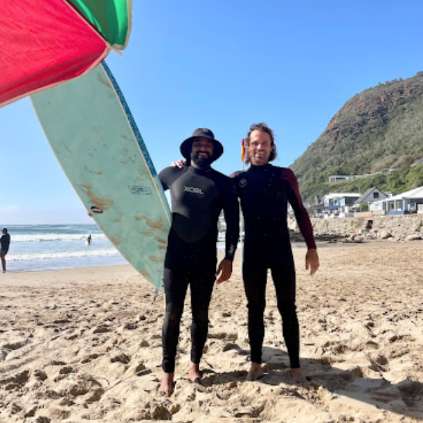 adin surf coach with student on the beach